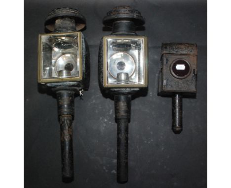 A pair of metal carriage lamps, length 49.5cm and a rear carriage lamp, height 26.5cm.