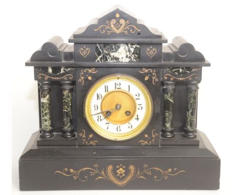 A Victorian black marble mantel clock, the white enamelled dial flanked by twin pillars, height 35cm, width 38.5cm.   Conditi