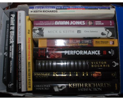 A box of Rolling Stones related books including "Paint It Black" by Geoffrey Giuliano".