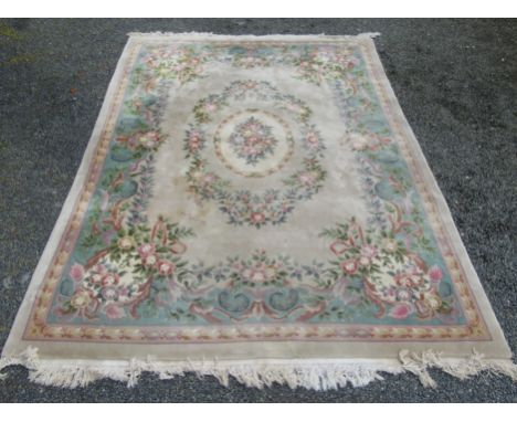 A large Chinese carpet with a polychrome floral medallion within a similar border, 370 x 277cm.   Condition report:  Conditio