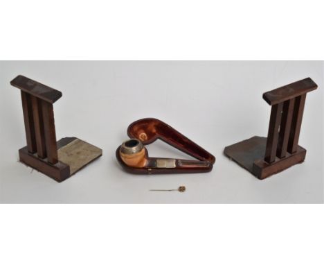 A cased meerschaum pipe, with an amber mouthpiece, length 14.5cm, a pair of mahogany bookends, height 15cm and a stick pin, l