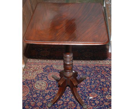 A George IV mahogany occasional table with quadruple base, together with a standard lamp.