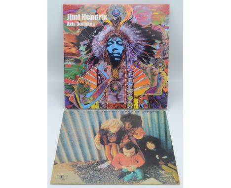 A copy of Jimi Hendrix "Band of Gypsys" album (Puppet Cover) and a copy of Axis Outtakes double album.