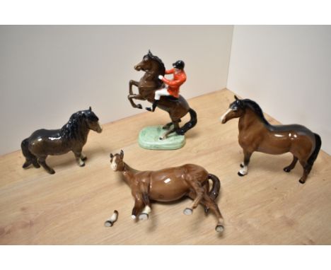 A Beswick Pottery Huntsman on Rearing Horse, model number 868, style two, designed by Arthur Gredington, small chip to horses