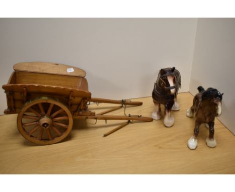 Two Beswick pottery style horses, with large pine trap having brass bound wheels