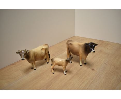 A Beswick Pottery Jersey Cow family, comprising Jersey Bull Ch 'Dunsley Coy Boy' model 1422, Cow Ch Newton Twinkle number 134