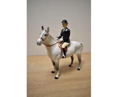 A Beswick Pottery Huntswoman, model number 1730, style two,  rider and horse stood still, designed by Arthur Gredington in ro