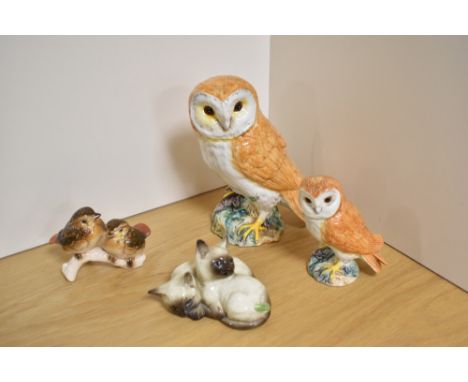 A Beswick Pottery barn owl, model 1046a first version with split tail feathers, designed by Arthur Gredington in golden brown