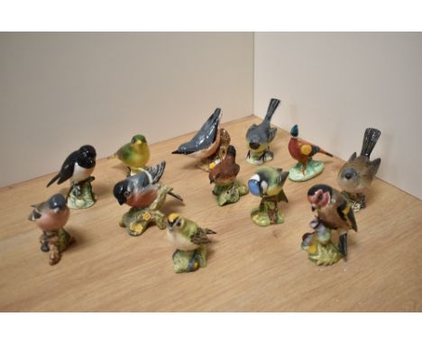 A group of twelve Beswick Pottery bird studies, comprising Stonechat 2274, Grey Wagtail 1041, Nuthatch 2413, Whitethroat 2106