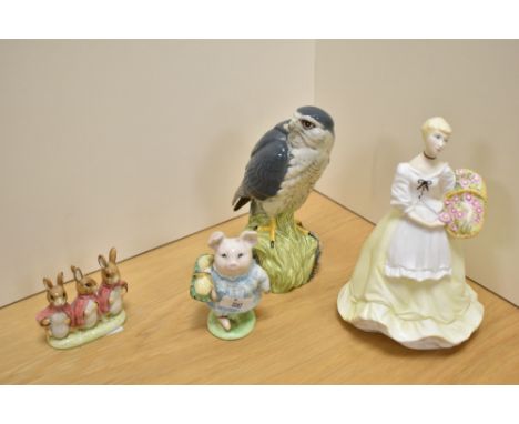 A Royal Worcester bone china figurine 'Spring Fair', sold together with a Royal Doulton Whyxte &amp; Macay Merlin scotch whis