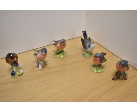 A group of six Beswick Pottery bird figures, comprising Goldfinch 2273, Chaffinch 991 x4 and wren with damaged beak