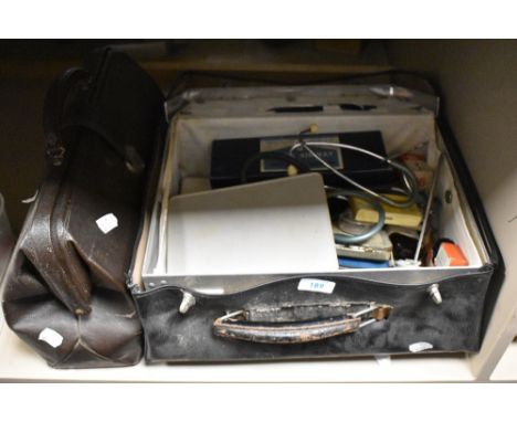 A Doctors case and contents, including stethoscope and similar medical implements and tools.