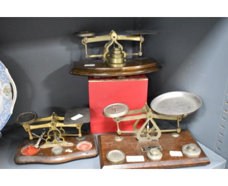Three sets of postal scales and weights, to include Ensign scales and weights