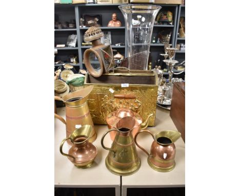 An early 20th century copper coach lamp, an a selection of mid century brass and copper wares, including jugs, embossed magaz