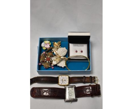 A box containing a Speedster Premier wristwatch, a Rotary moon phase wristwatch, and decorative brooches