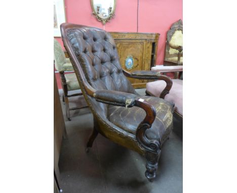 A William IV mahogany and leather upholstered button back armchair