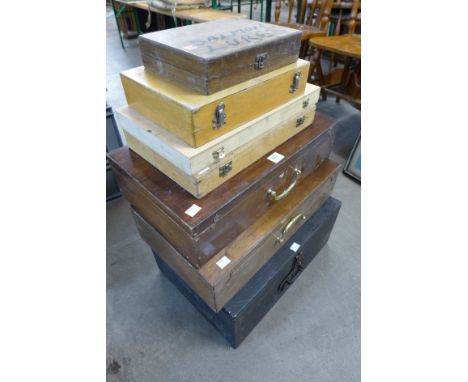 A wooden tool box and six other boxes