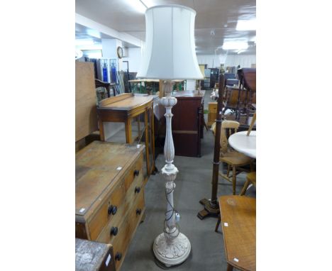 A cream standard lamp