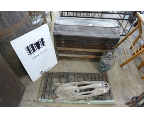 A dome topped trunk, enamelled sign, carved wooden mask, printers tray and a hanging lantern