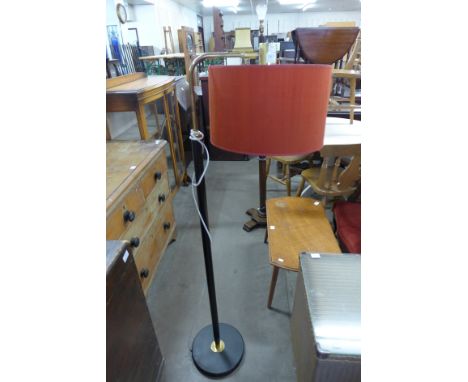 A black and brass standard lamp