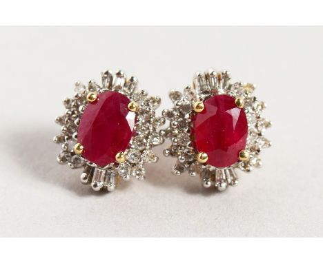 A PAIR OF 14CT YELLOW GOLD, RUBY AND DIAMOND CLUSTER EARRINGS OF 2.2CTS approx.