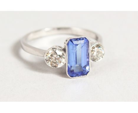 AN 18CT GOLD BAGUETTE DIAMOND CUT SAPPHIRE AND DIAMOND RING.