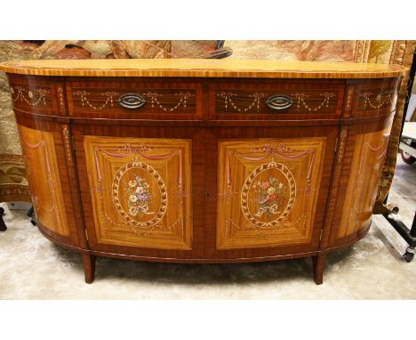 A GOOD HEPPLEWHITE REVIVAL SATINWOOD, MAHOGANY AND ROSEWOOD BOWFRONT COMMODE, profusely painted with musical trophies, harebe