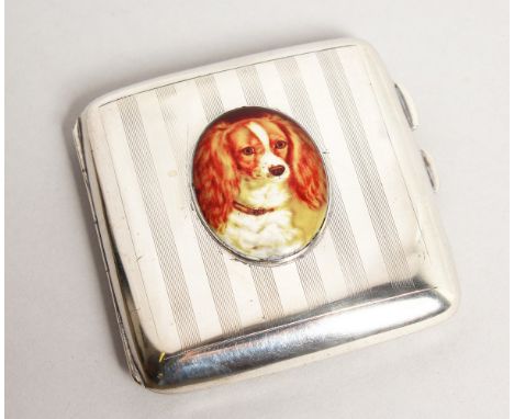 AN ENGINE TURNED SILVER CIGARETTE CASE. Birmingham 1917 with an enamel of a dog.