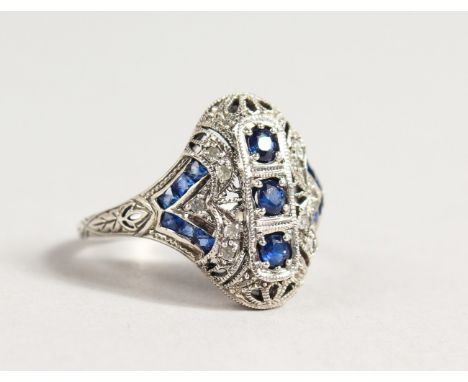 A SILVER, DIAMOND AND SAPPHIRE SET RING.