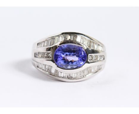 A 14CT WHITE GOLD AMETHYST AND DIAMOND RING.