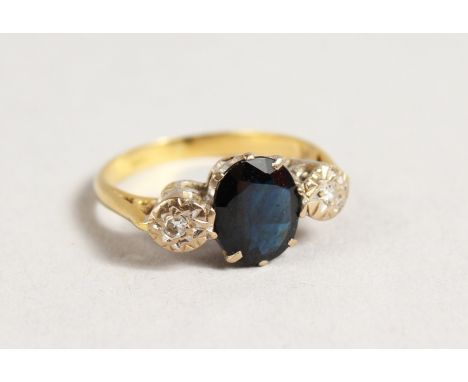 AN 18CT GOLD, SAPPHIRE AND DIAMOND THREE STONE RING.