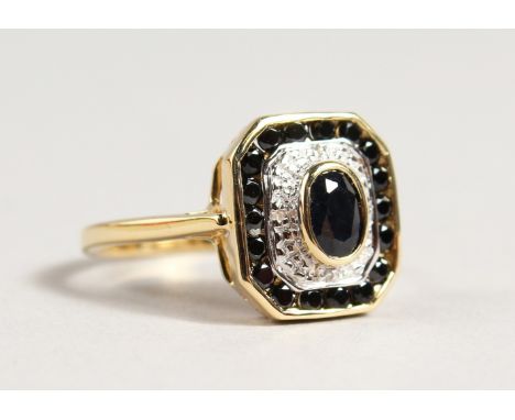 A 9CT GOLD, BLACK STONE AND DIAMOND DECO STYLE RING.