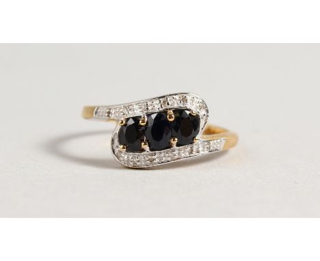 A 9CT GOLD SAPPHIRE AND DIAMOND RING.