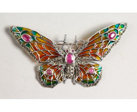 A LARGE SILVER RUBY SET BUTTERFLY BROOCH.
