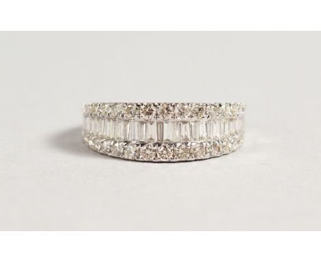 AN 18CT GOLD DIAMOND AND BAGUETTE DIAMOND ETERNITY RING.