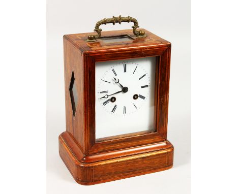 A 19TH CENTURY ROSEWOOD INLAID MANTLE CLOCK with white dial and carrying handle. 8ins high.