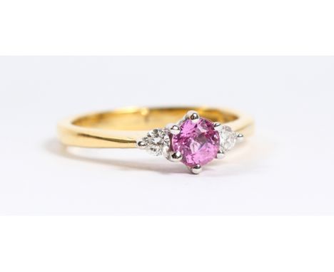 AN 18CT GOLD PINK SAPPHIRE AND DIAMOND RING.