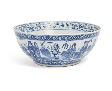 A large Chinese blue and white punch bowl, Qing dynasty, 19th century, Decorated to the exterior with artisans, vendors, and 