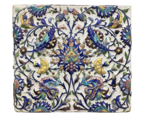 A square moulded polychrome pottery tile in the Iznik style,     Qajar Tehran, Iran, c.1890, The blue, turquoise blue, auberg