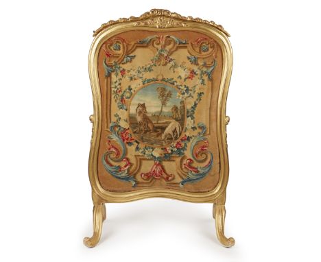 A French giltwood firescreen, Early 20th century, Inset with a piled wool picture of Aesop's fable 'The Wolf and the Lamb', l