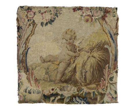 An Aubusson tapestry fragment, Second half 18th century,Woven in wools and silks, depicting a winged cherub on a hay bale, wi