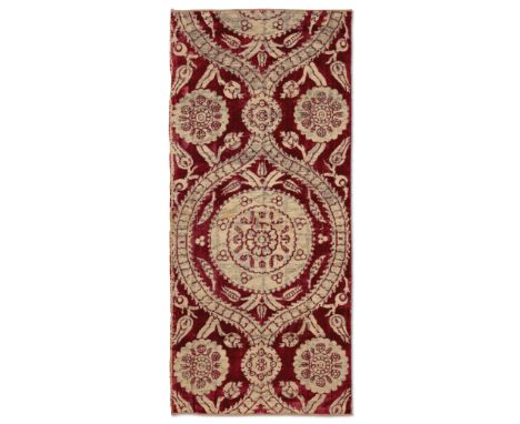 Two voided crimson velvet and silk çatma panels,Ottoman Bursa or Istanbul, 17th century,Each woven with large offset floral r