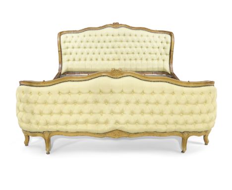 A French walnut framed bed, Of Louis XV style, first half 20th century, With carved floral crest