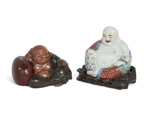 A Chinese famille rose figure of Budai and a Japanese painted plaster figure of Hotei,Republic period and 20th century,The fa