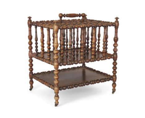 A Napoleon III rosewood bobbin-turned canterbury,Third quarter 19th century,With four vertical divisions and a turned handle 
