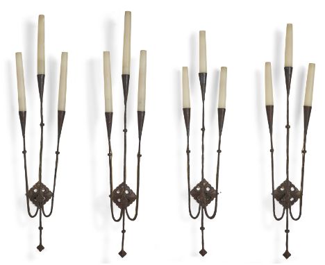 A set of four wrought iron three-light wall appliques, Made to order for George Farrow, second half 20th century,  With taper