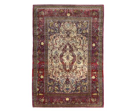 A Persian silk Kashan rug,First quarter 20th century,&nbsp;The central field with floral medallion surrounded by floral swags