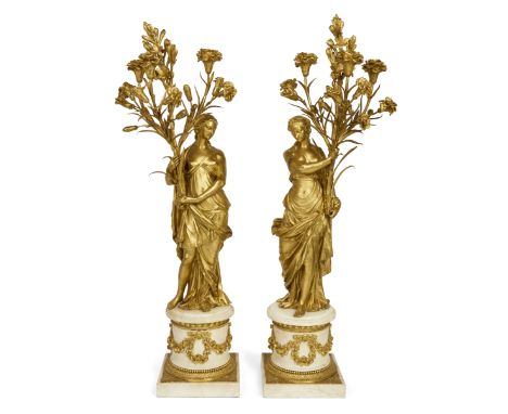 A pair of French ormolu figural three-light candelabra, After a model by François Rémond, of Louis XVI style, late 18th / ear