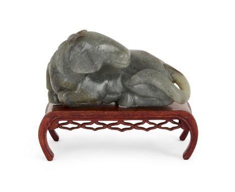 A Chinese Ming style grey jade figure of a recumbent horse, Republic period, Carved with head turned toward its back, with ca