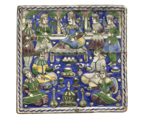 A moulded polychrome and figural pottery tile, Qajar revival style, 20th century, An enthroned ruler and his courtiers feasti